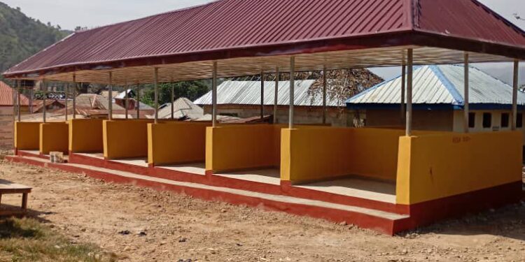 Chief Martin Orim facilitates market construction in Obanliku.